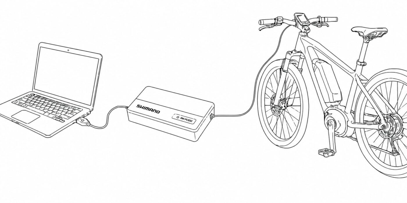 Shimano SM-PCE02 interface connected to a Windows computer and an e-bike